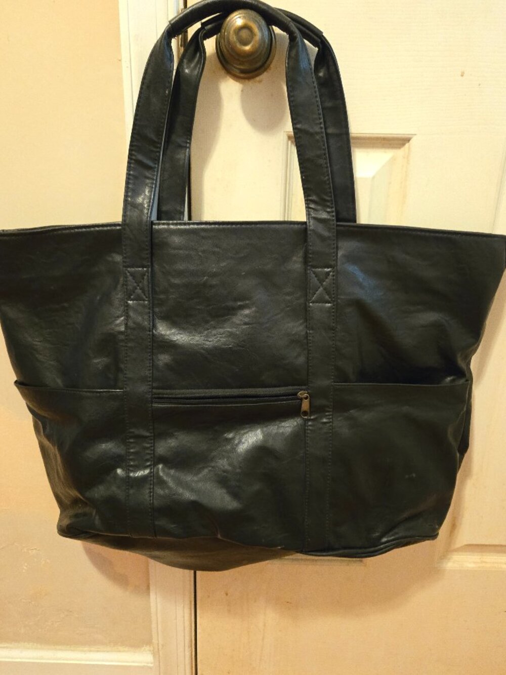 Genuine black leather tote/weekender. New never been carried.